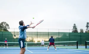 four-men-playing-double-tennis-during-daytime